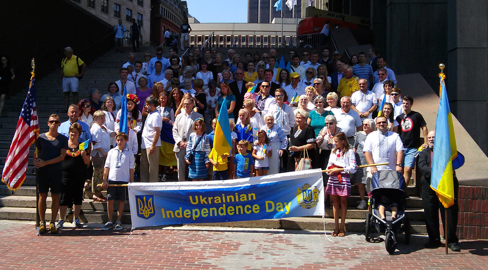 Community gathers on steps of city hall for a group photo