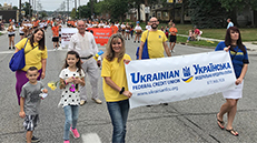 People holding a sign during a parade