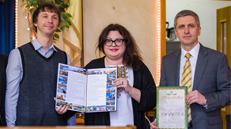 Two males and one female presentation of certificates