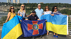 Group photo with people holding flags