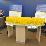Violinist with yellow gift bags