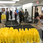 Violinist next to yellow gift bags