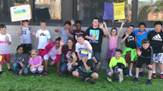 group of children waving