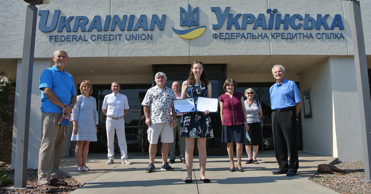 Female student is presented with scholarship awards