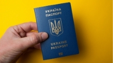 Ukrainian passport in hand