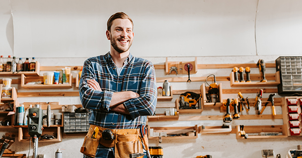 Carpenter Smiling In Work Shop