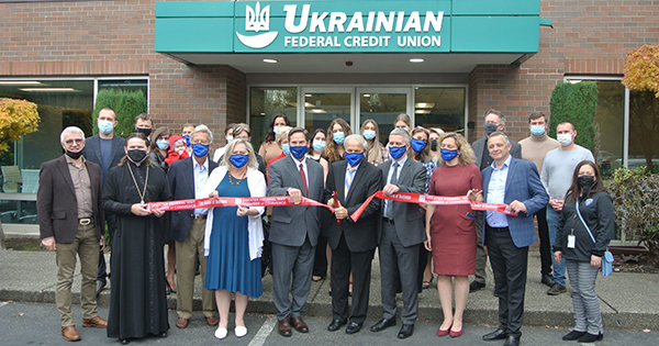 group of professionals at ribbon cutting