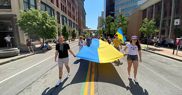 Young adults marching in parade