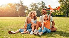 Happy Family In Field