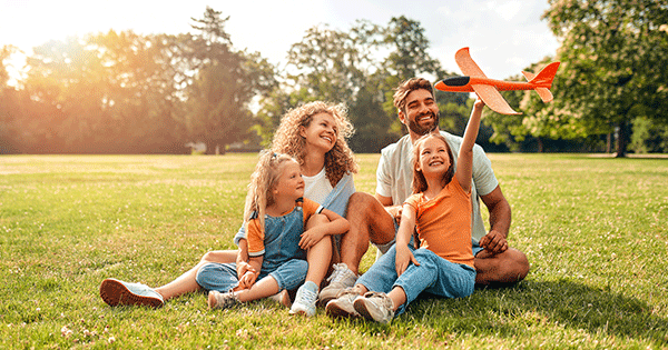 Happy Family In Field