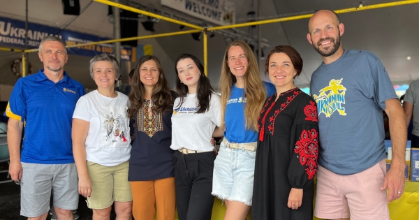 employees smiling at festival